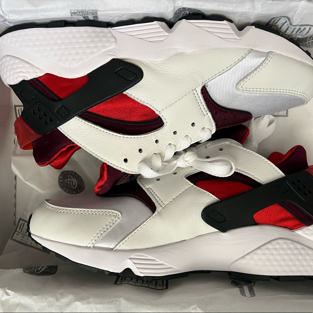 Brand new. Limited edition men size 9.5 Nike Huarache. No smoking/pet home.